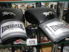 A pair of Lonsdale London boxing gloves.