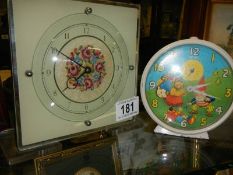 A Noddy clock and one other.