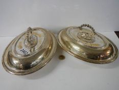 A pair of silver plate vegetable tureens.