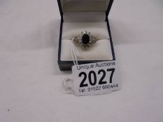 A large raised sapphire and diamond yellow gold ring, size K, 3.1 grams.