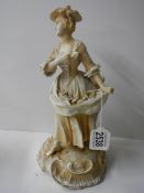 A continental porcelain figure, some minor chips.