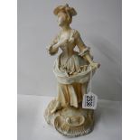 A continental porcelain figure, some minor chips.