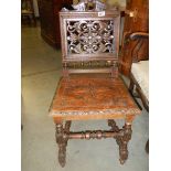 A heavily carved oak hall chair, COLLECT ONLY.