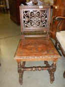 A heavily carved oak hall chair, COLLECT ONLY.