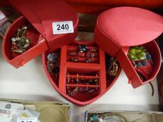 A heart shaped jewellery box containing rings, earrings, necklaces etc.,
