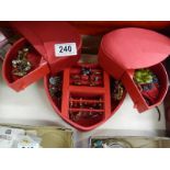 A heart shaped jewellery box containing rings, earrings, necklaces etc.,