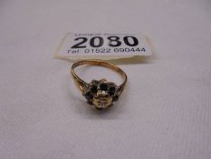 A 9ct gold cluster ring, size N half, 2.2 grams.