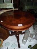 A dark wood tea table with inlaid top on tripod base Diameter 50cm, height 59cm COLLECT ONLY