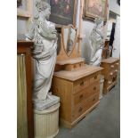 A pair of tall female garden statues on pedestals, COLLECT ONLY.