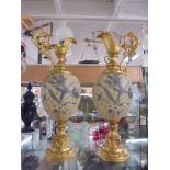 A pair of gilded and ceramic hand painted ewers, COLLECT ONLY.