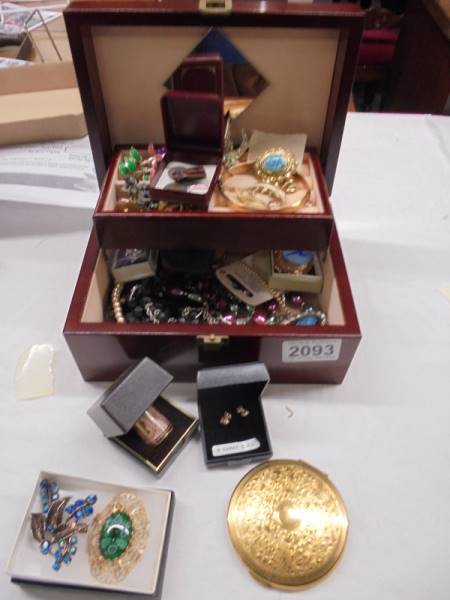 A jewellery boxes containing necklaces, brooches etc.,