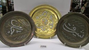 Three Indian brass trays with white metal overlay.