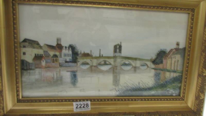 A gilt framed and glazed watercolour featuring a bridge over river, signed A Abbot 1927.