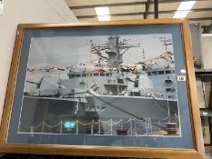 A large framed and photo of a battleshi[