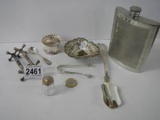 A pair of silver sugar nips together with silver plate stilton scoop, knife rests etc.,