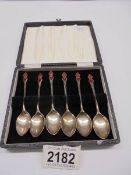 A cased set of Art Deco sterling silver enamelled teaspoons by W H Haseler, Birmingham 1934, 40 gram