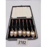 A cased set of Art Deco sterling silver enamelled teaspoons by W H Haseler, Birmingham 1934, 40 gram