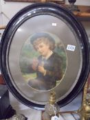 An oval framed and glazed study of a young boy, COLLECT ONLY.