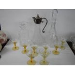 Two glass decanters, a claret jug and set of eight glasses.