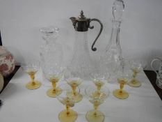 Two glass decanters, a claret jug and set of eight glasses.