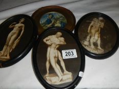 Three oval prints of statues and one other.
