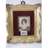 A framed portrait painting on ivorex of an Elizabethan lady, signed but indistinct.