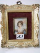 A framed portrait painting on ivorex of an Elizabethan lady, signed but indistinct.