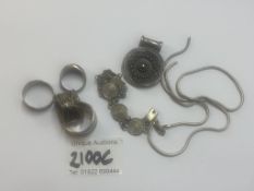 A quantity of silver rings and and items