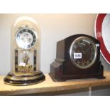 A glass dome painted anniversary clock (needs wire) and a 1930's oak mantle clock COLLECT ONLY