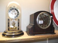 A glass dome painted anniversary clock (needs wire) and a 1930's oak mantle clock COLLECT ONLY