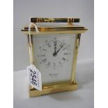 A Woodford brass carriage clock. in working order.