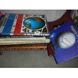 A quantity of various atlases.