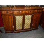 An early Victorian flame mahogany sideboard with mesh doors. COLLECT ONLY.
