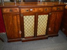 An early Victorian flame mahogany sideboard with mesh doors. COLLECT ONLY.