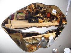 A decorative lips wall mirror COLLECT ONLY