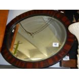 A circular framed bevel edged mirror. COLLECT ONLY.