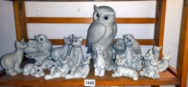 A collection of Quarry critters including cats, bears, and a quantity of Fantasia owl figurines