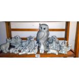 A collection of Quarry critters including cats, bears, and a quantity of Fantasia owl figurines