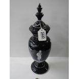 A Victorian hand decorated lidded black glass vase. COLLECT ONLY.