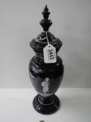 A Victorian hand decorated lidded black glass vase. COLLECT ONLY.