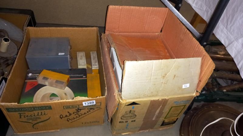 A boxed Paximat Triumph slide projector and various slides