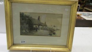 A framed and glazed watercolour coastal cottage scene, signed F Meginn.