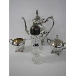 A three piece silver plate tea set vy B Rogers Silver Co., and a sugar sifter.