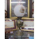 A brass oil lamp with shade, COLLECT ONLY.