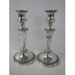 A pair of silver plate candlesticks, 23cm.