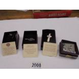 A Past Times silver cross, silver cat pin, silver treble clef brooch & pair of white metal earrings