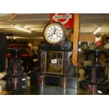A Victorian slate three piece clock garniture in working order, COLLECT ONLY.