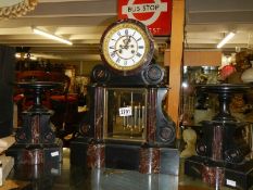 A Victorian slate three piece clock garniture in working order, COLLECT ONLY.