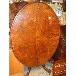 A Victorian walnut oval tip top table, COLLECT ONLY.