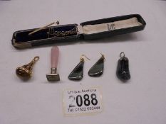 A mixed lot including 9ct gold tie pin, pendant, earrings, seal etc.,